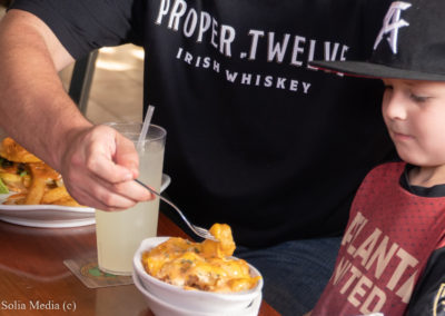 Celtic Tavern Kid Friendly Pub - Young Boy With Father Eating Lunch